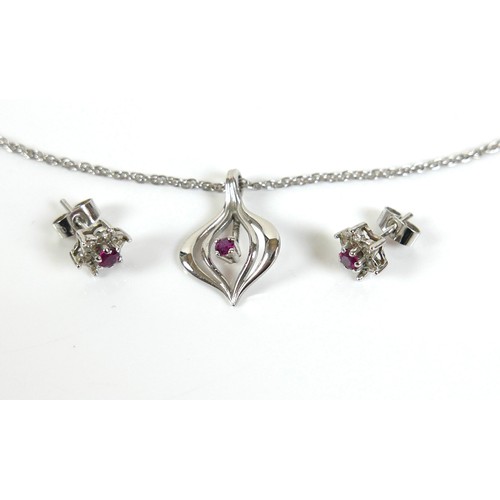 276 - Three pieces of white gold and ruby jewellery, comprising a pair of 18ct white gold ruby and diamond... 