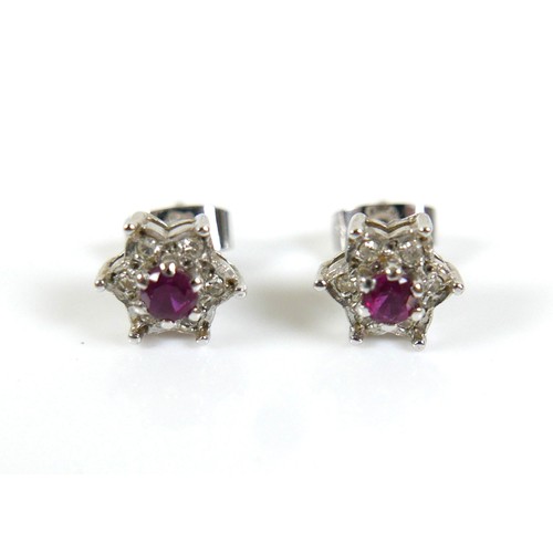 276 - Three pieces of white gold and ruby jewellery, comprising a pair of 18ct white gold ruby and diamond... 