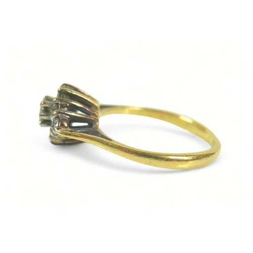 214 - An 18ct gold and diamond ring, set with nine round cut stones in a diamond pattern, central stone 0.... 