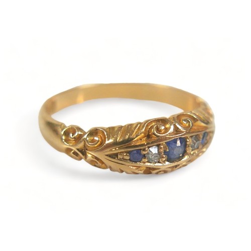 300 - An 18ct yellow gold ring, set with three blue sapphires, central 2.5mm, and two small diamonds withi... 