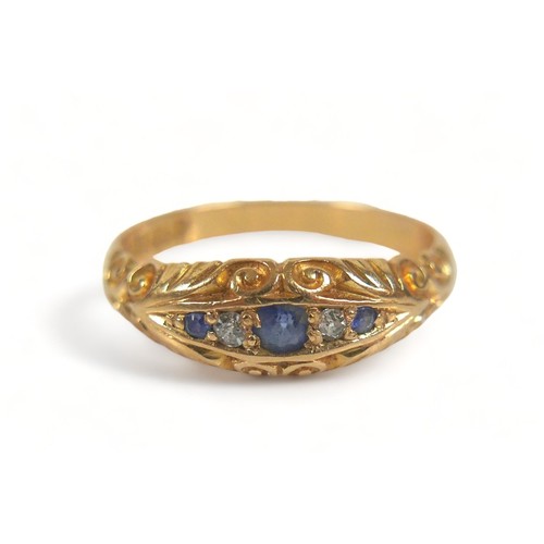 300 - An 18ct yellow gold ring, set with three blue sapphires, central 2.5mm, and two small diamonds withi... 