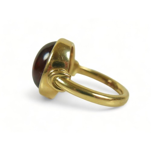 303 - An 18ct yellow gold amber ring size Q, weight 14.3 grams, head size 18mm by 15mm.