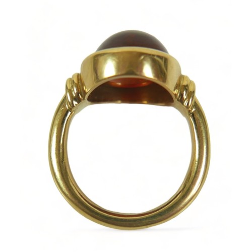 303 - An 18ct yellow gold amber ring size Q, weight 14.3 grams, head size 18mm by 15mm.