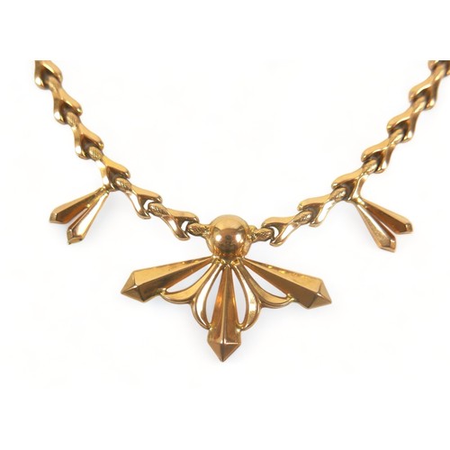 339 - An 18ct gold necklace with wishbone segments, with central ball and starburst design, marked 750, It... 