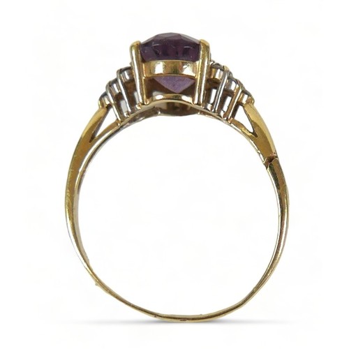 273 - A 14ct gold amethyst and diamond ring, the pear shaped central stone,  flanked by six small white di... 