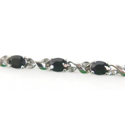 230 - A 9ct white gold diamond and sapphire bracelet, 18cm long, weight 9.1 grams.