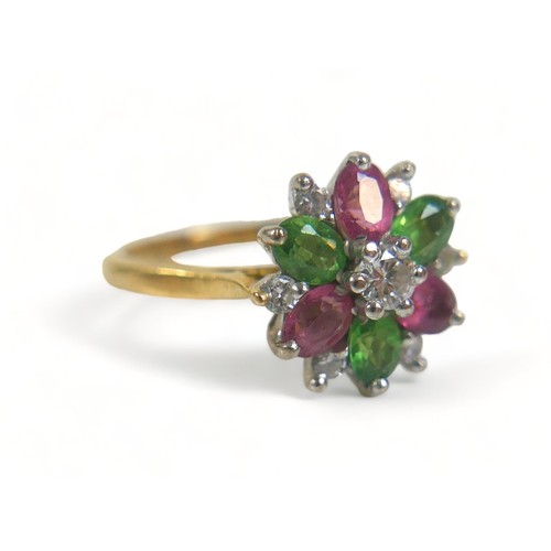 335 - An 18ct gold, diamond and tourmaline thirteen-stone flowerhead cluster ring, the central brilliant c... 