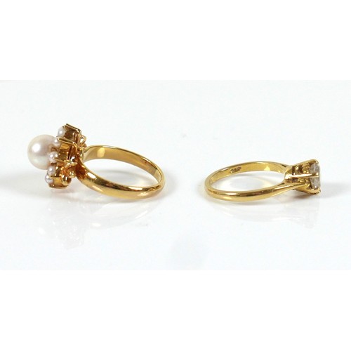 294 - Two gold rings, one marked 585 / 14k set with large pearl and ring of smaller pearls and leaf should... 