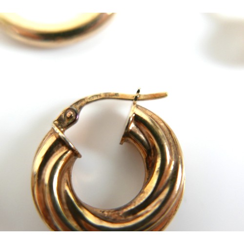 222 - Three pairs of 9ct gold hoop earrings, comprising a large hoop pair, 1.2g, a rope twist pair, 1.8g, ... 