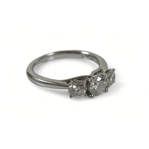 346 - A platinum three stone 1ct diamond ring, retailed by Goldsmiths, marked CT1.00 to inner shank, size ... 