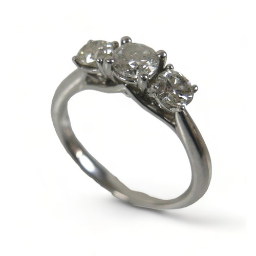 346 - A platinum three stone 1ct diamond ring, retailed by Goldsmiths, marked CT1.00 to inner shank, size ... 