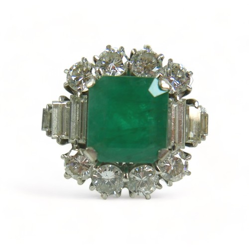 355 - An 18ct white gold emerald and diamond ring, the central square faceted cut emerald approximately 9.... 