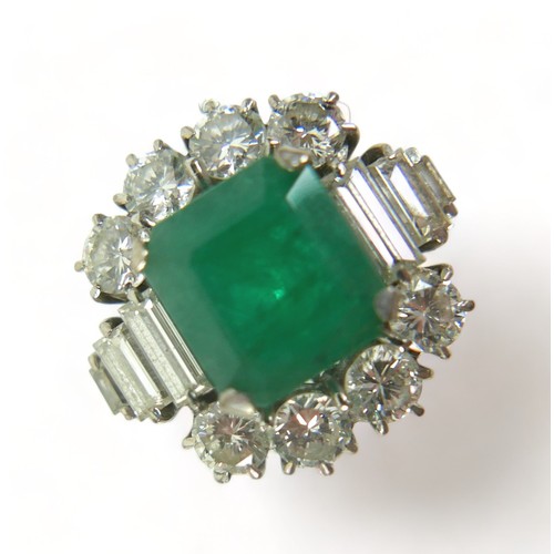 355 - An 18ct white gold emerald and diamond ring, the central square faceted cut emerald approximately 9.... 