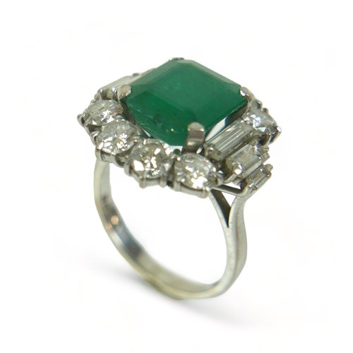 355 - An 18ct white gold emerald and diamond ring, the central square faceted cut emerald approximately 9.... 