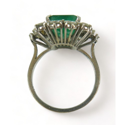 355 - An 18ct white gold emerald and diamond ring, the central square faceted cut emerald approximately 9.... 