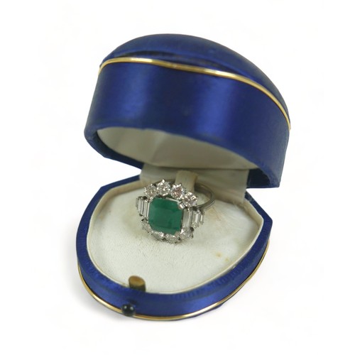 355 - An 18ct white gold emerald and diamond ring, the central square faceted cut emerald approximately 9.... 