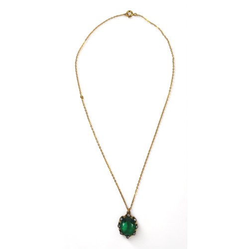 284 - A gilt metal diamond and green stone pendant on chain and matching earrings, each 15mm by 19mm, chai... 