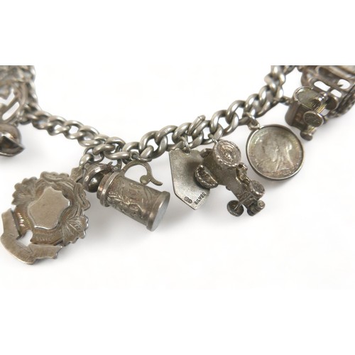 170 - A silver charm bracelet 106 grams/3.4 troy oz