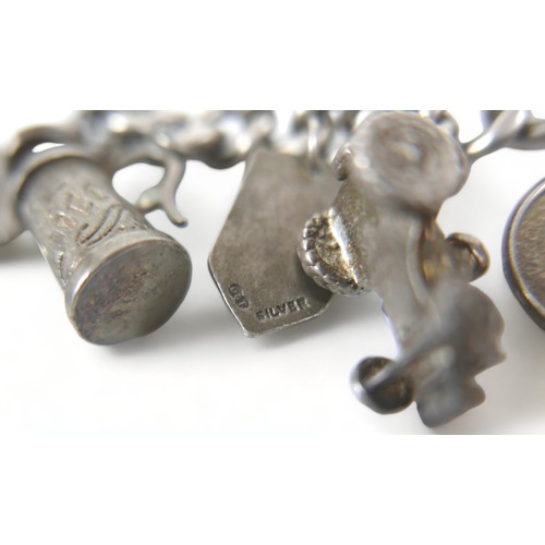 170 - A silver charm bracelet 106 grams/3.4 troy oz