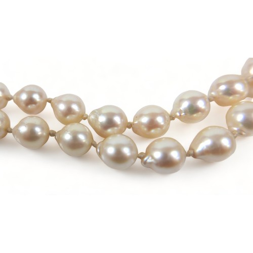 182 - A double string of pearls with a 14ct yellow gold clasp, 47cm long, average size of pearls 7mm.