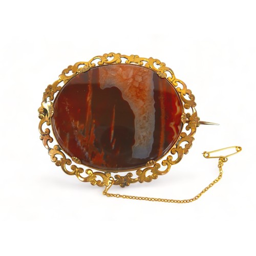 235 - A gilt metal agate brooch, a gilt metal cameo, a gilt metal mourning brooch, a 9ct part brooch, a pa... 