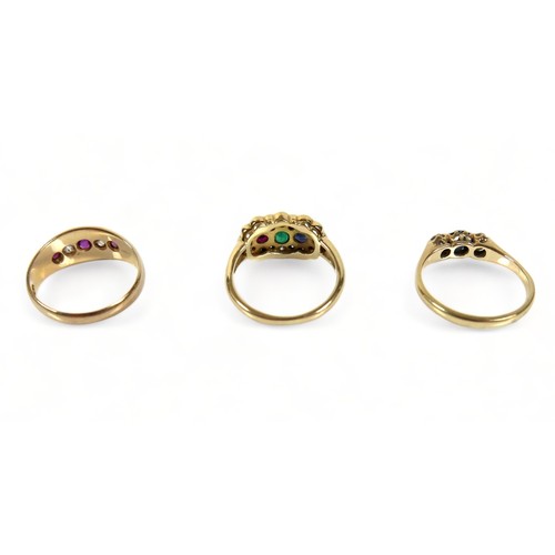 253 - A group of three rings, comprising an 18ct gold five stone, diamond and ruby ring, 2.6g, an 18ct gol... 