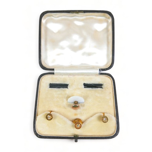 211 - Three 18ct and diamond shirt/waistcoat dress studs, 3.9 grams, boxed with a shirt stud.