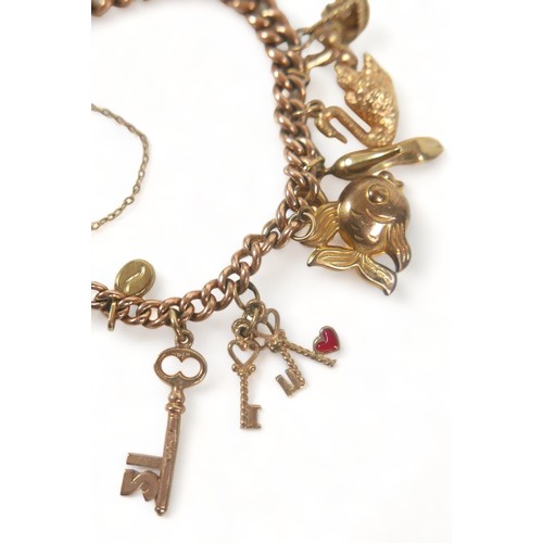 341 - A 9ct gold charm bracelet, fitted with heart shaped padlock clasp, kerb links, and sixteen charms, i... 