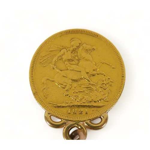 352 - A George IIII gold sovereign, 1821, fitted with a ring to an 18ct gold kerb link chain, with occasio... 