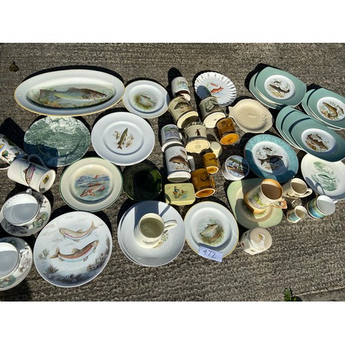 472 - A collection of fish plates, mugs etc