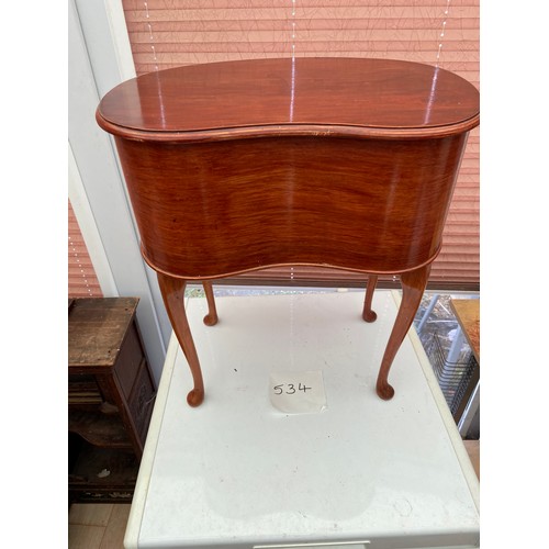 534 - A kidney shaped sewing table