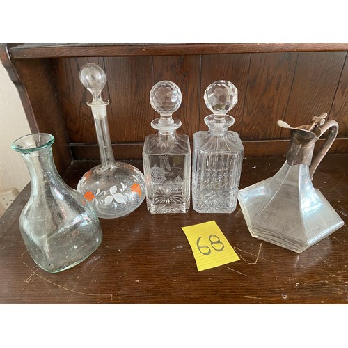 68 - Collection of 5 decanters including one plated, one painted glass, one etched and 1 cut glass