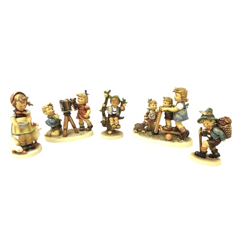 99 - A group of five large Hummel china figurines, comprising Scooter Tim, Camera Ready (1977-2002) 25 ye... 