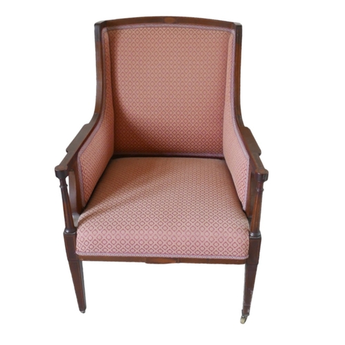 655 - An Edwardian mahogany armchair, upholstered in a pink diamond patterned fabric, raised on tapering s... 