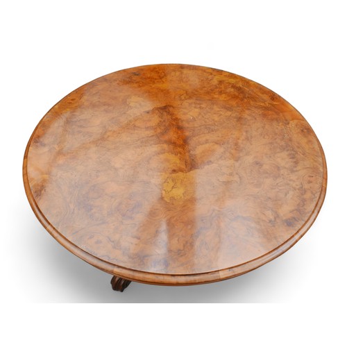 610 - A Victorian Burr walnut breakfast table, with tilt top and raised on three cabriole scroll feet, 121... 