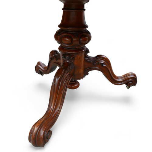 610 - A Victorian Burr walnut breakfast table, with tilt top and raised on three cabriole scroll feet, 121... 