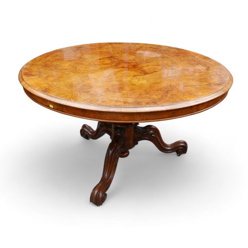 610 - A Victorian Burr walnut breakfast table, with tilt top and raised on three cabriole scroll feet, 121... 