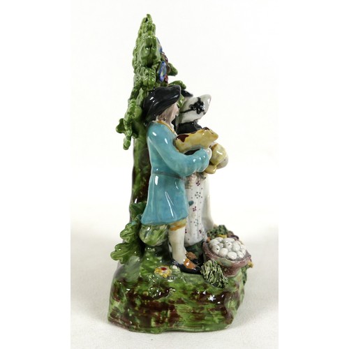 79 - A group of Staffordshire ceramics, including 19th century Staffordshire pearlware figure group 'The ... 