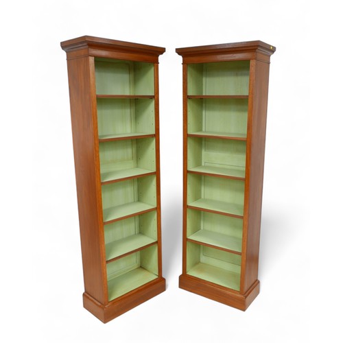 645 - A pair of full new height walnut bookcases with painted interior and five adjustable shelves, 56.5cm... 