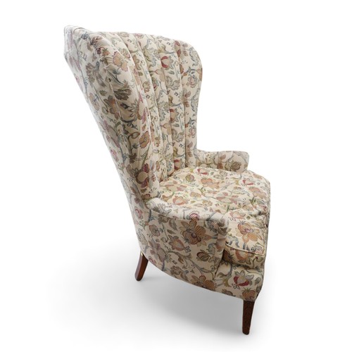 616 - An early 19th century mahogany fan back library chair upholstered in a regency style foliate fabric,... 