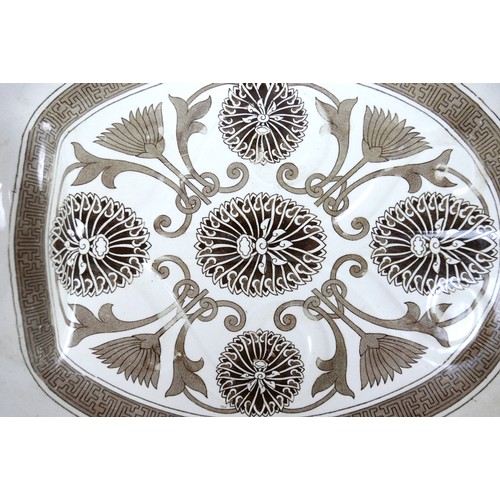 74 - A Marigold pattern meat plate with a well, 48cm by 40cm by 6cm.