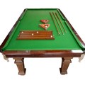 An early 1900s Harrods mahogany snooker dining table, with four leaves standing on square section re... 