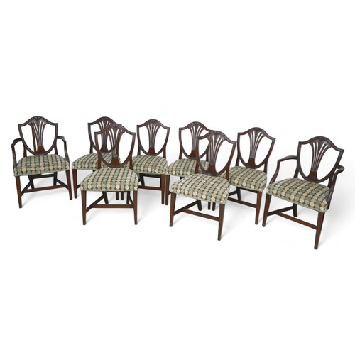 617 - A set of eight mahogany dining chairs in the Georgian taste, with overstuffed seats, including two c... 