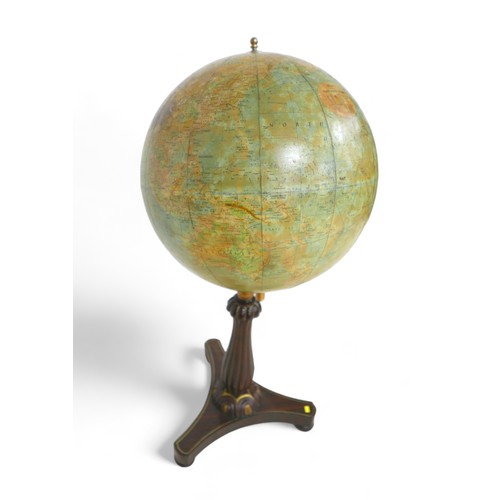 640 - A Philips 19 inch library globe on a mahogany tripartite platform stand, 48 by 108cm tall.