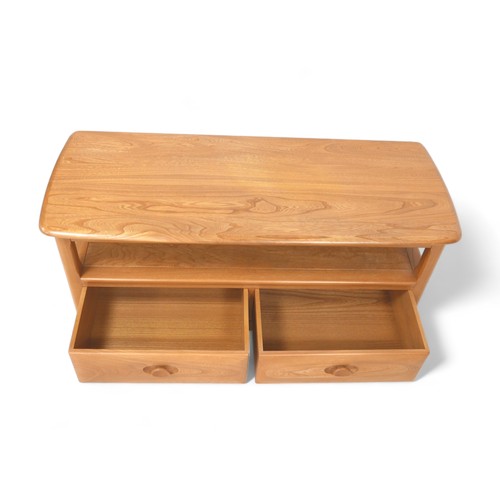 613 - An Ercol blonde elm TV stand with two drawers, 112 by 44.5 by 48cm tall.