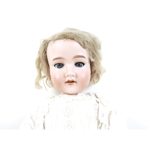 190 - An Armand Marseille bisque porcelain headed doll with open mouth and sleepy eyes, 80cm tall.