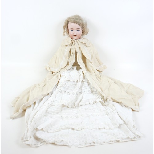 190 - An Armand Marseille bisque porcelain headed doll with open mouth and sleepy eyes, 80cm tall.