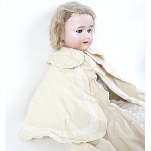 190 - An Armand Marseille bisque porcelain headed doll with open mouth and sleepy eyes, 80cm tall.