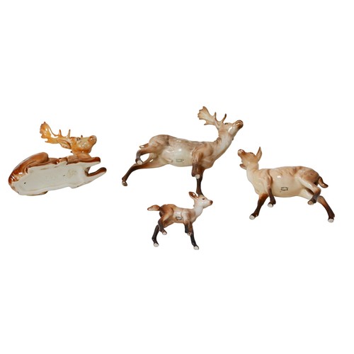 70 - Four Beswick deer figurines, comprising two stags, a doe and a fawn. (4)