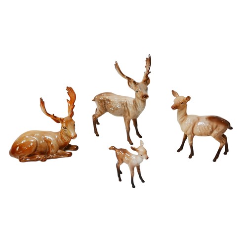 70 - Four Beswick deer figurines, comprising two stags, a doe and a fawn. (4)